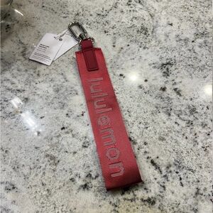 Lululemon never lost keychain in Merlot red